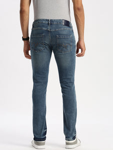 Slim Fit Mid Rise  Ice Blue Torn Jeans